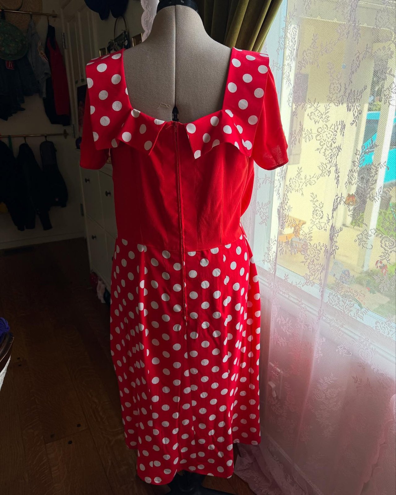 Back view on the dress form, ruffled collar